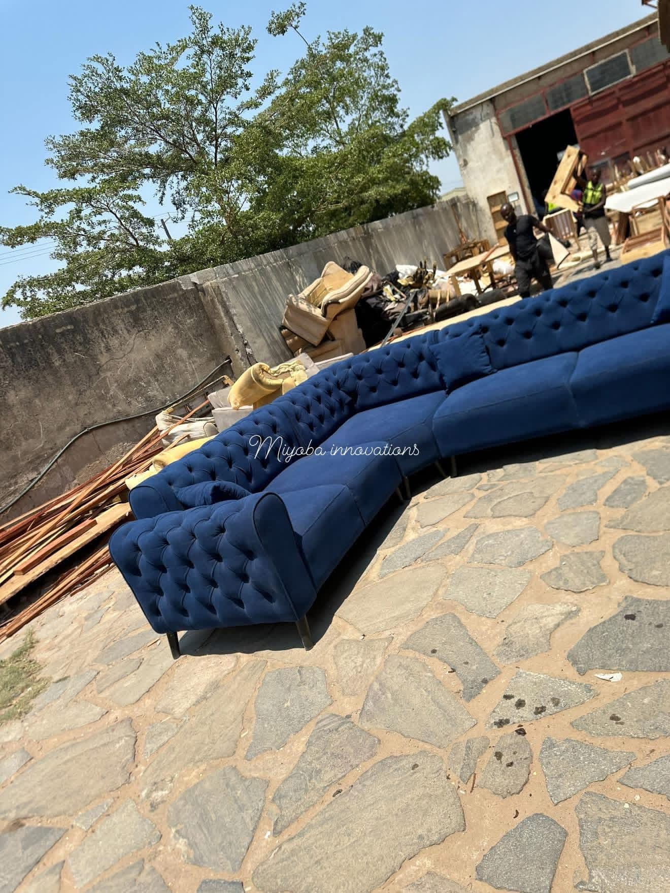 Curved blue velvet tufted chesterfield sectional sofa