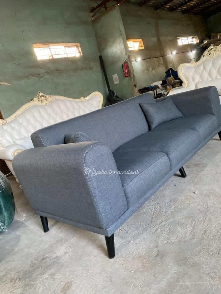 Contemporary grey fabric three-seater sofa with wooden legs