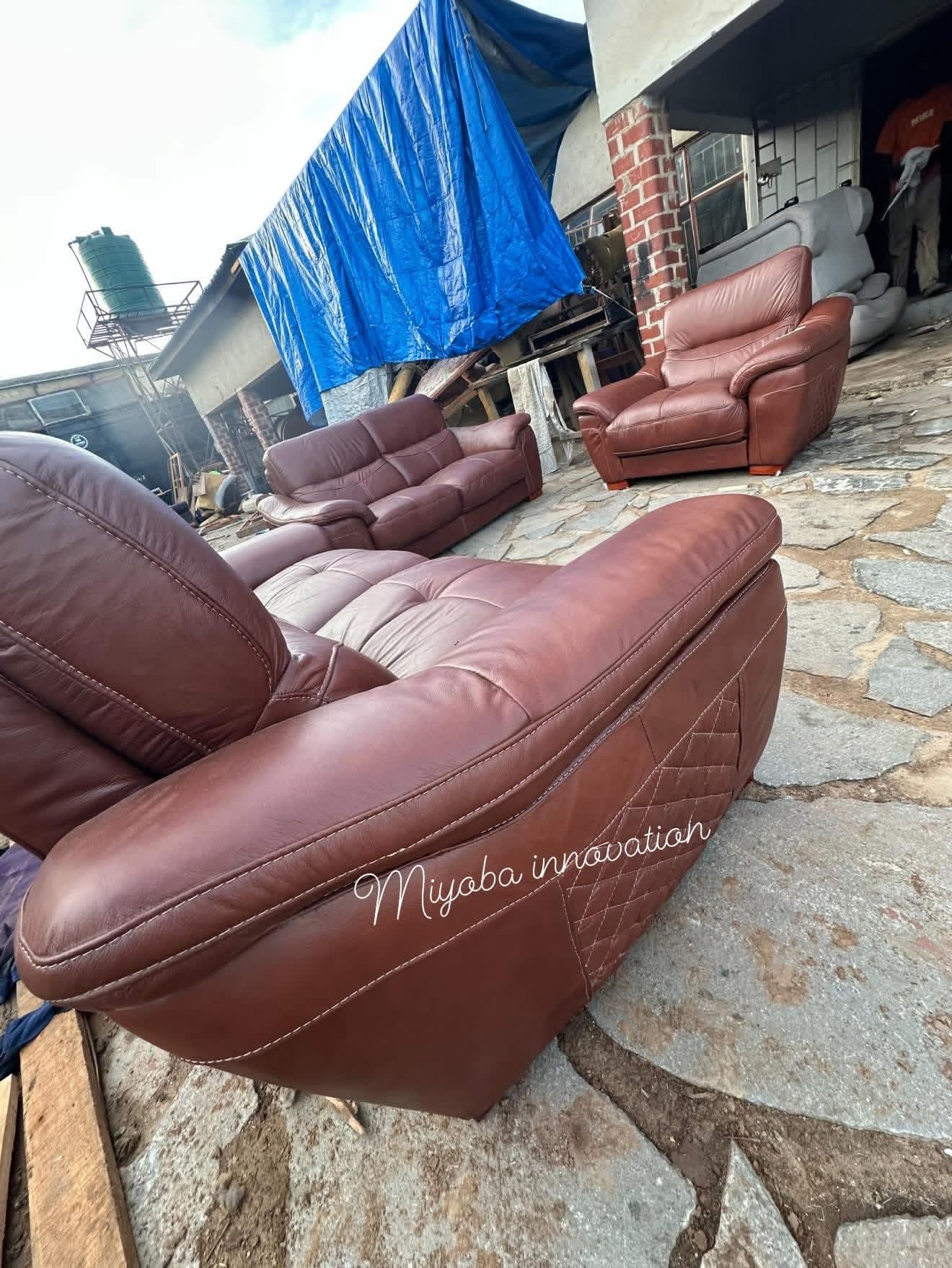 Classic burgundy leather sofa and armchair suite