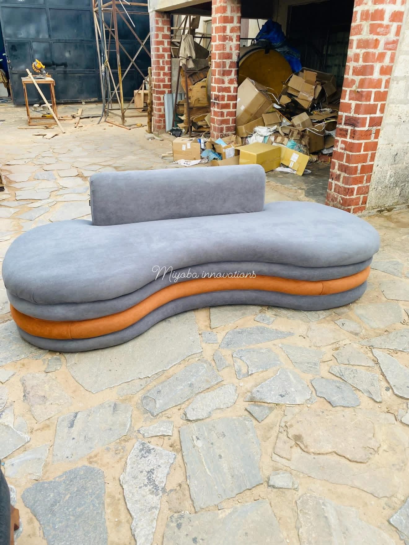 Sculpted grey and orange two-tone curved daybed